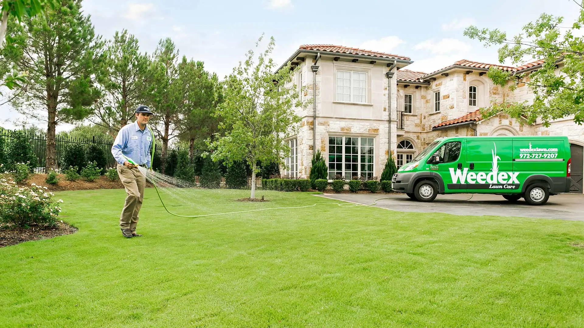 Weedex Lawn Care lawn expert treating lawn grass in Dallas, TX.