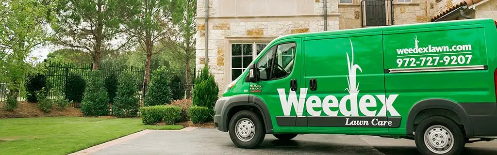 Weedex Lawn Care service truck in Dallas, TX.
