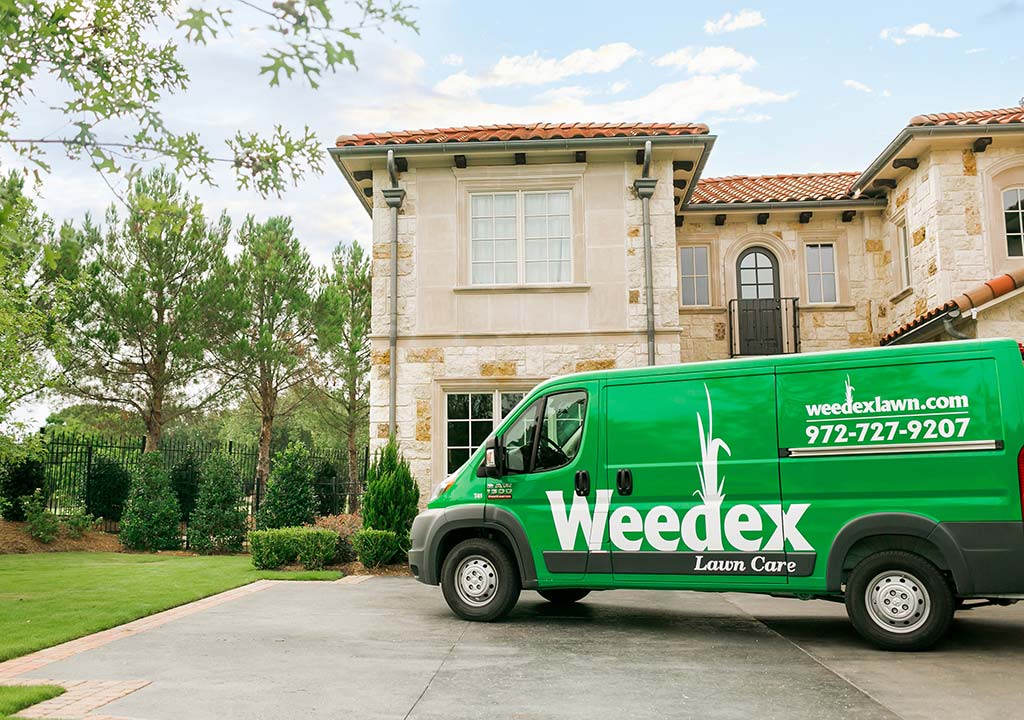 Weedex Lawn Care service van in front of a home in Fort Worth, TX.